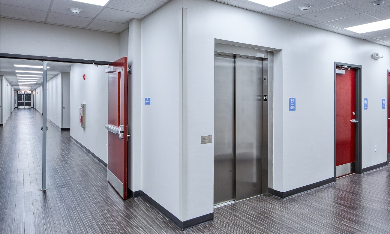 School corridor with elevator and durable flooring
