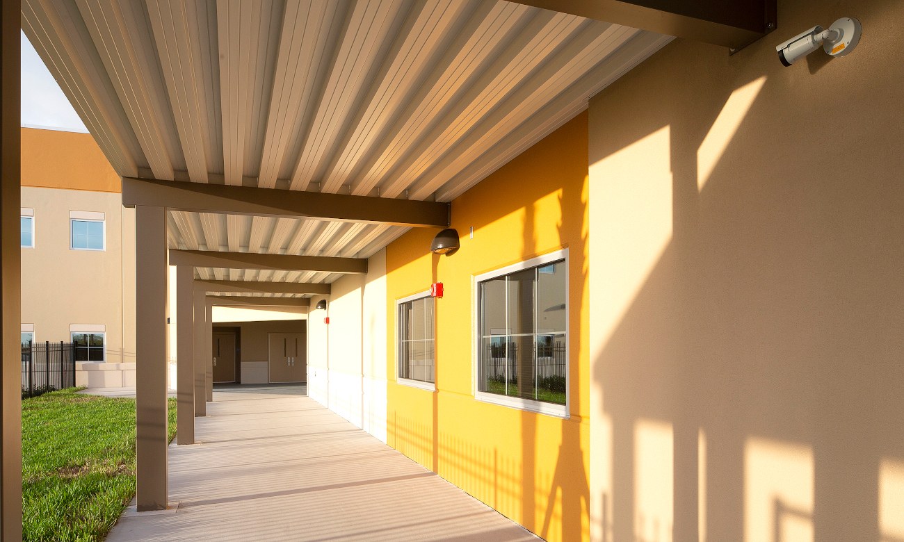 Covered school walkway with metal canopy