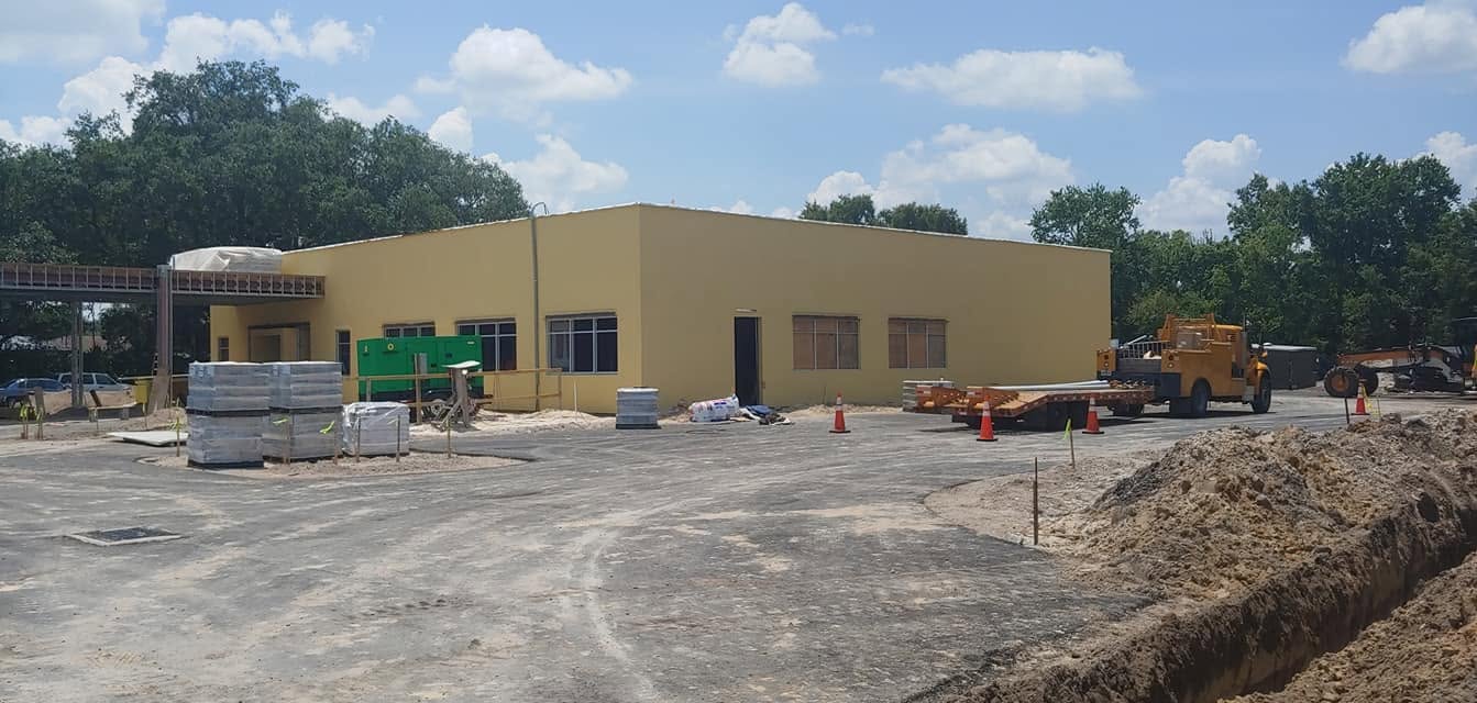 DaVita healthcare facility exterior with site work and equipment during construction