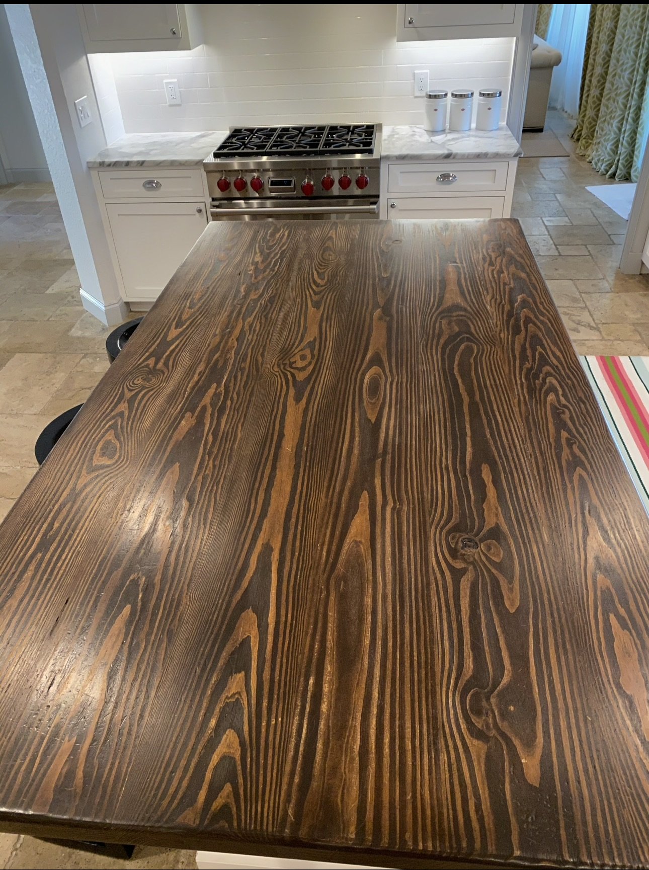 Wood kitchen island with waterfall countertop