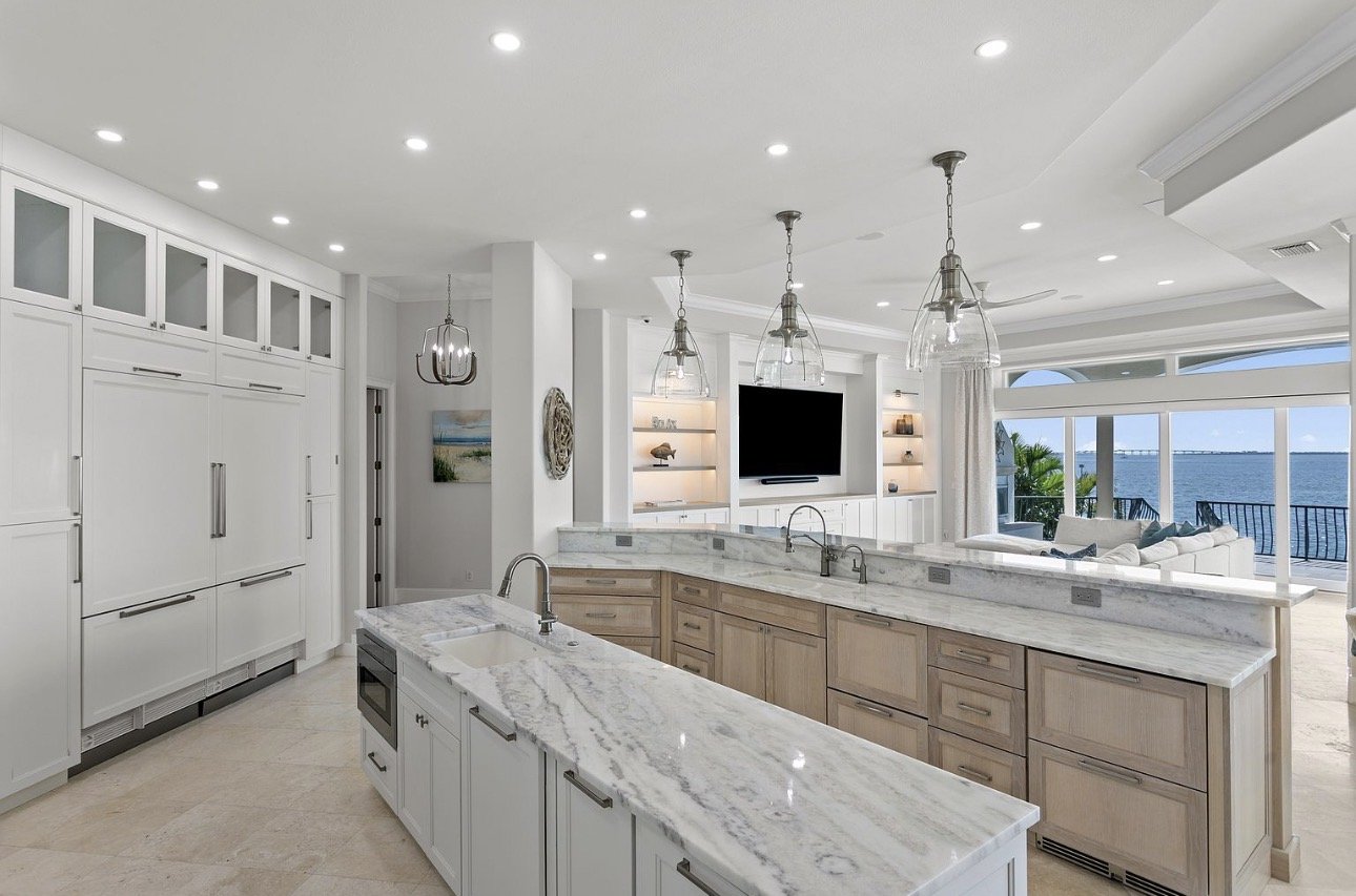 White kitchen with marble island and custom cabinetry