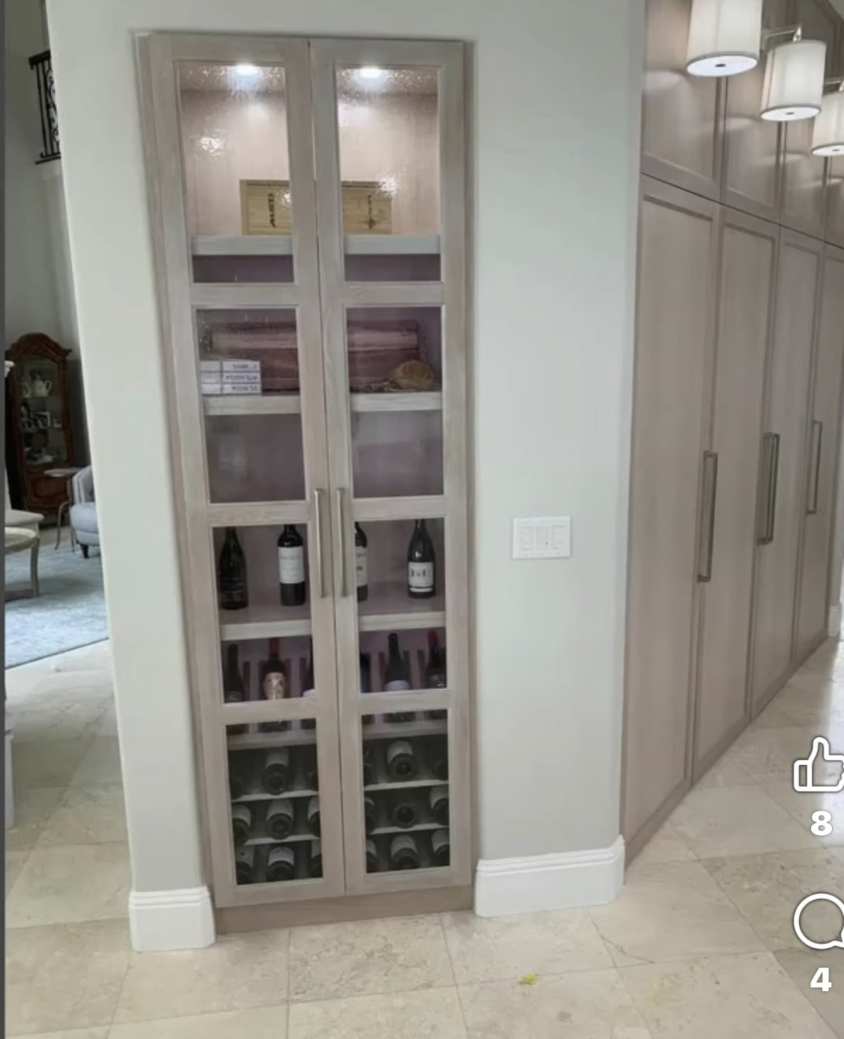 Built-in wine storage behind glass cabinet doors