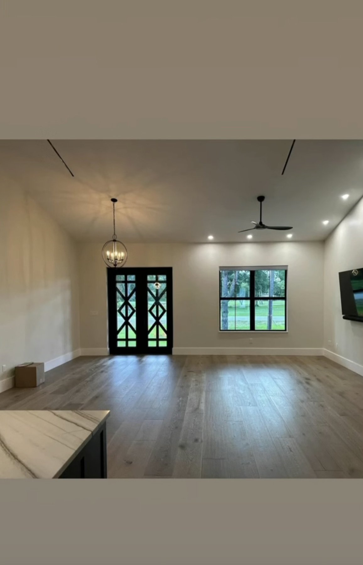 Open living and dining area with wood flooring