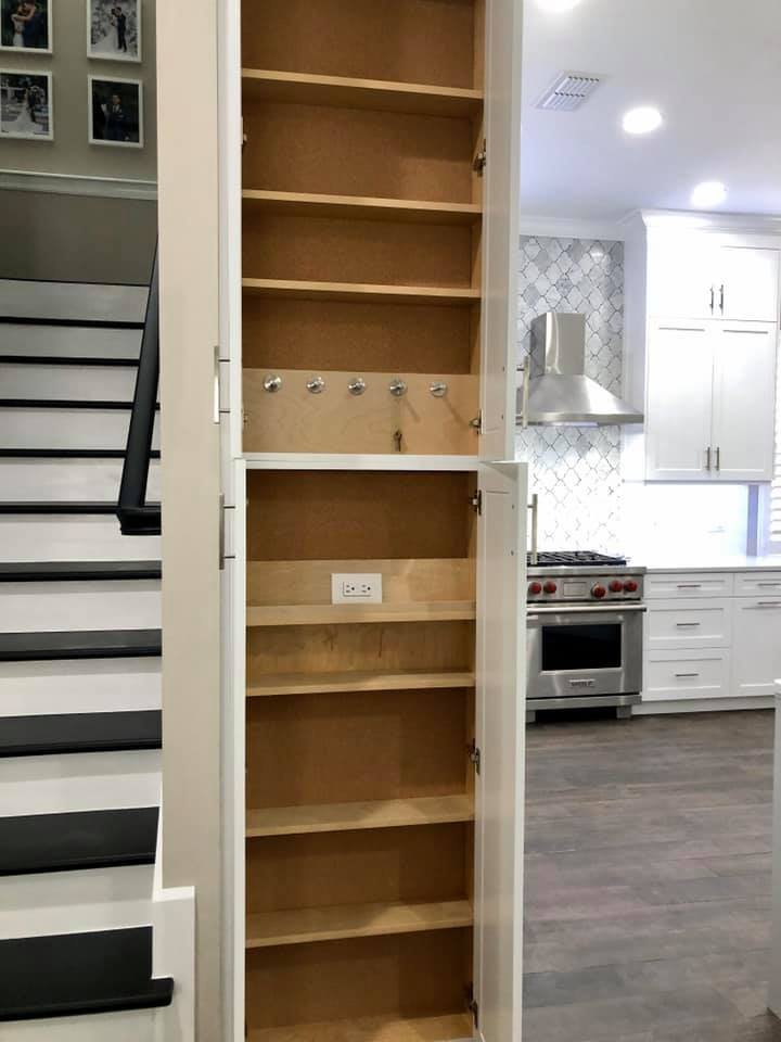 Pull-out pantry shelving beside kitchen cabinetry