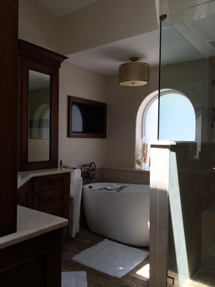 Bathroom with vessel sinks and arched window