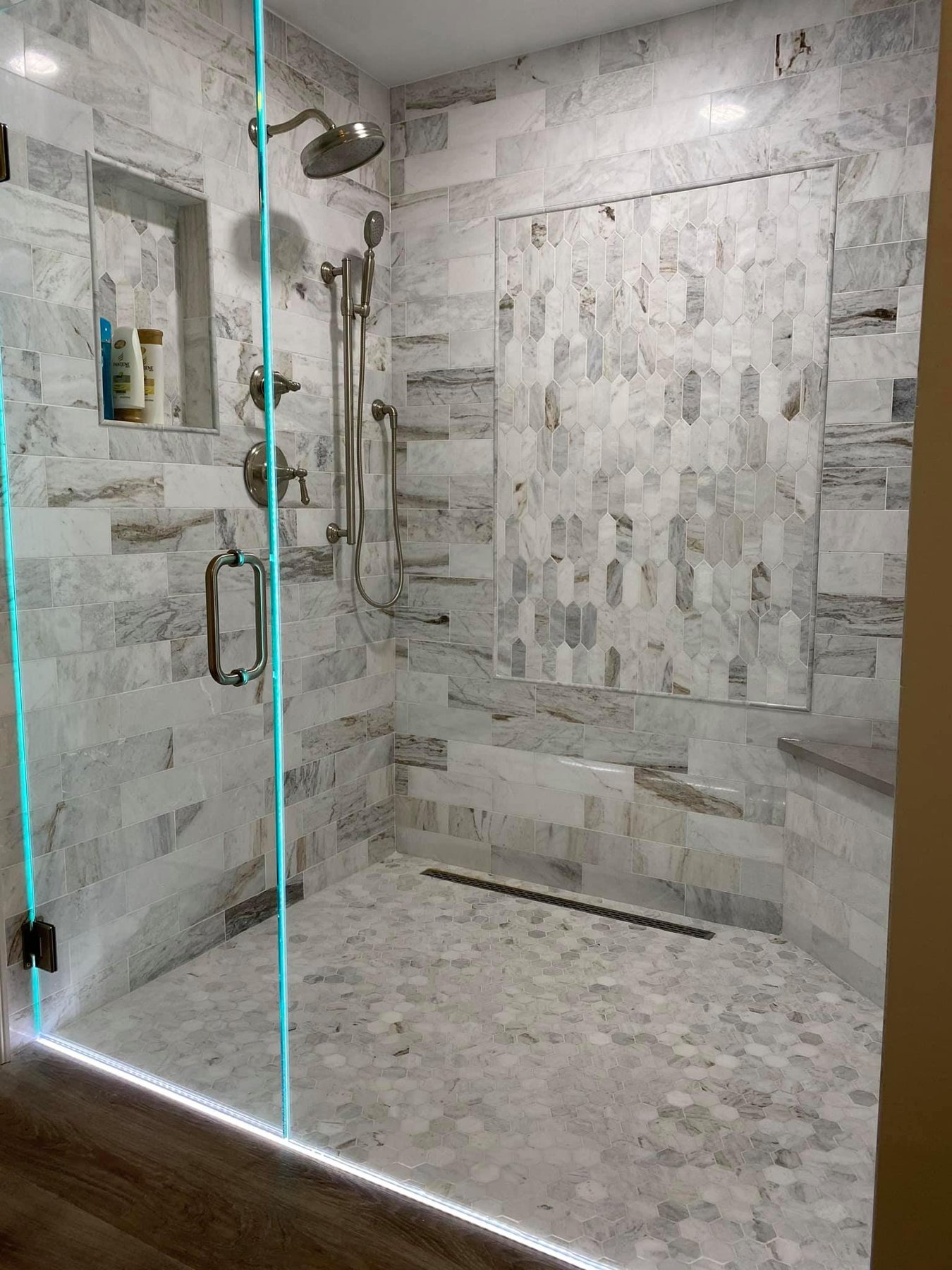 Walk-in shower with textured stone tile